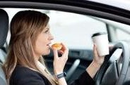 Driver eating donut